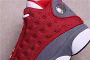Close-up of the red patterned side panel and gray heel overlay.