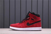 Side profile highlighting the red upper, black Swoosh, ankle branding, white midsole, and dark outsole.