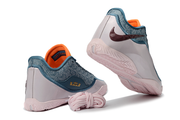 Blue, pale pink and orange Nike LeBron 23 basketball shoes shown from the rear with pink laces.