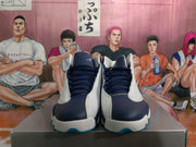 Front view of navy and white Jordan basketball sneakers, showing dark laces, perforated overlays, and visible tongue branding.