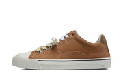Side view of a brown and tan sneaker with an off-white sole and thin black stripe.