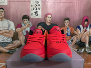 Front view of pink and orange basketball shoes