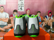 Rear view showing the Nike Wrestling heel text and bright green collar accents.