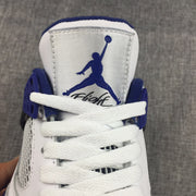 Close-up of the tongue showing the blue Jumpman-style logo, white laces, and blue collar lining.