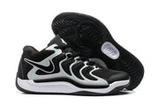 Underside and side view showing the black rubber outsole with a dense wavy traction pattern.