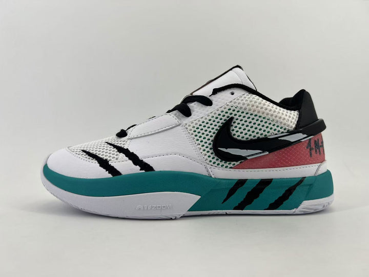 Side view of a white, teal, and black Nike basketball sneaker with mesh panels and graphic accents.