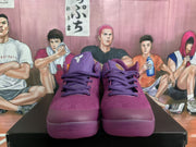 Front view of purple Nike Kobe basketball shoes with lace-up closures