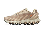 Side profile highlighting the sculpted midsole and visible circular cushioning elements