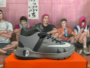 Side view of a grey and black Nike KD basketball shoe with white Swoosh detail and an EU 35 sample marking