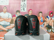 Rear view showing red Jumpman and 23 graphics on the black sneaker heels.