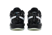Rear view of the black sneakers showing white side stripes, black heel sections, and translucent outsole edges.