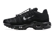 Side profile of a black sneaker with silver-tone Swoosh detail and sculpted sole
