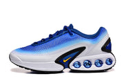 Side view of a blue and white sneaker with visible cushioning pods
