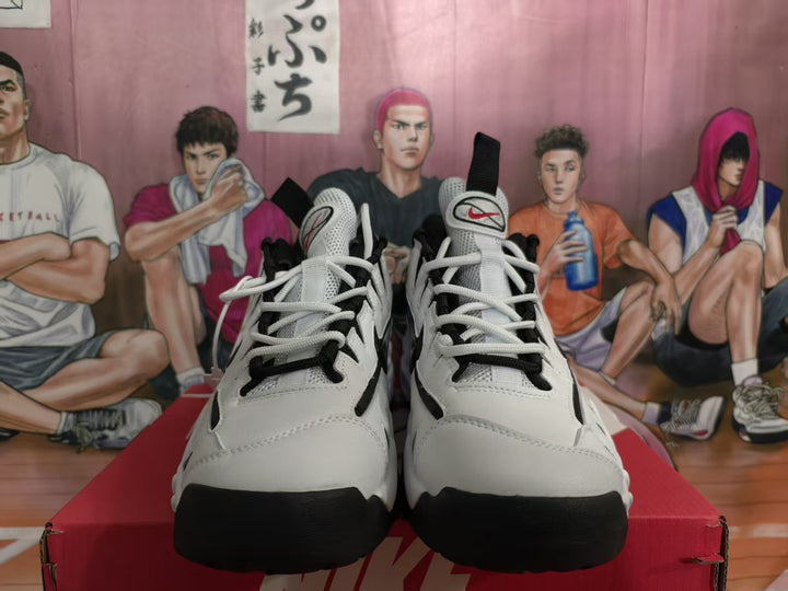 Front view of white and black Nike sneakers