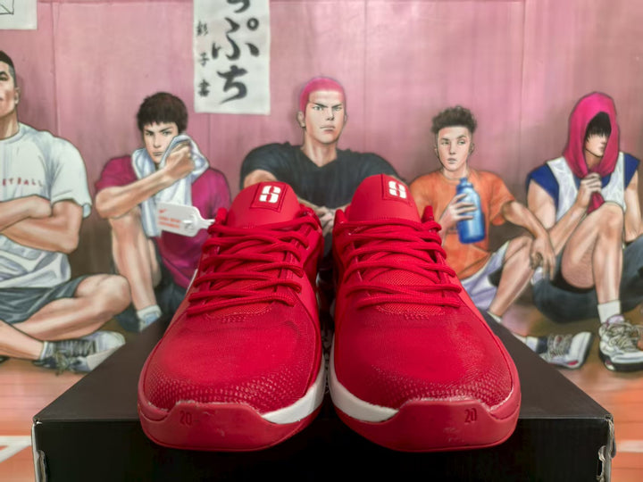 Front view of red and white Nike basketball sneakers displayed on a box