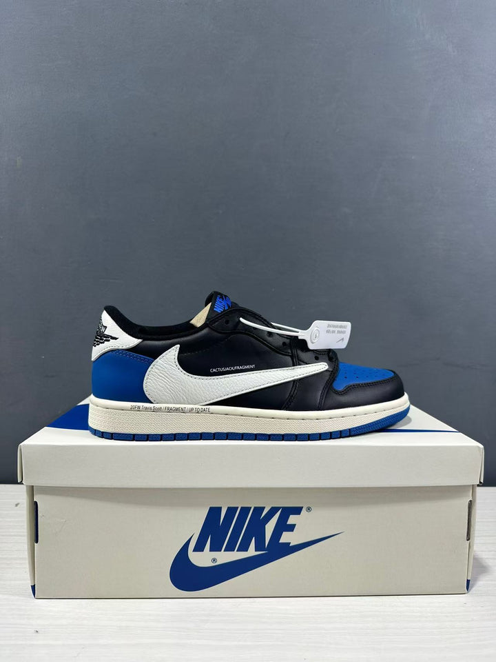 Side view of black, blue, and white low-top sneakers displayed on a Nike shoebox.