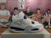 Side view of a white and navy high-top sneaker showing mesh paneling, molded lace supports, and a visible midsole cushioning window.