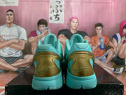 Rear view of the teal sneakers showing translucent gold heel panels and embossed heel details.