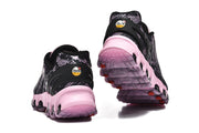Rear view of Nike Air Max DN8 sneakers showing the black heel panels and pink soles.