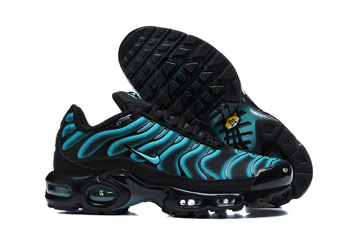 Nike Air Max Plus sneakers in black and blue, shown from the side with one shoe turned to display the outsole.