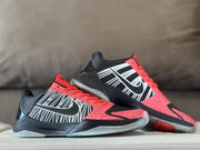 Pair of Kobe 5 shoes showing side profiles and red accents