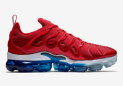 Side profile of a red sneaker with white midsole and blue translucent sole.