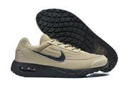 Tan and black Nike Air Max sneaker shown beside its patterned outsole.