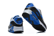 Rear and outsole views of Nike Air Max 90 sneakers with blue, black, and white details.