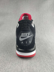 Rear view showing the Nike Air heel branding, black upper, and red outsole edge.