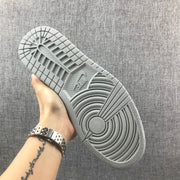 Underside view showing the light gray rubber outsole with circular traction patterns.