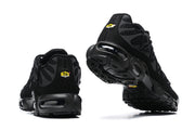 Rear and outsole views of black Nike Air Max Plus sneakers