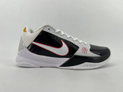 Side profile highlighting the white and black upper, red accents, and low-cut shape