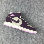 Angled view of the white and purple high-top sneaker with contrasting pink outsole.
