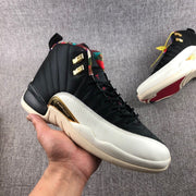 Angled side view highlighting the black high-top upper, multicolor collar, light forefoot, and gold side accent.