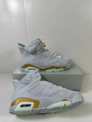 Close angled view showing the perforated upper, visible air unit and textured outsole.