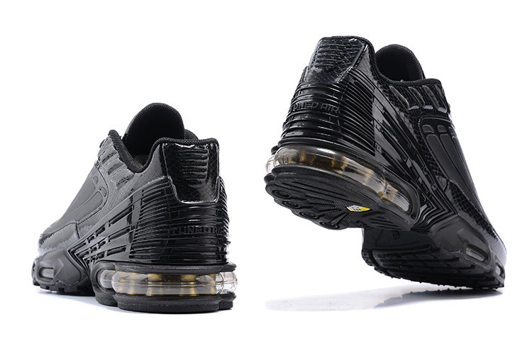 Rear views of black Nike Air Max Plus III sneakers with visible cushioning units.