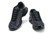 Front views of black and charcoal Nike Air Max Plus sneakers with blue lace details.