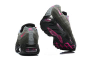 Rear and outsole views of Nike Air Max 95 TT sneakers with pink accents.