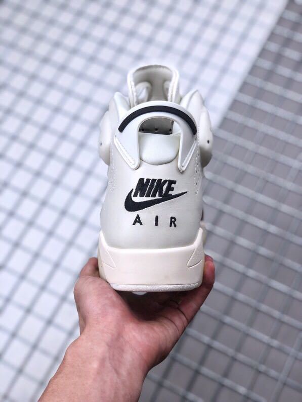 Rear view of the white Jordan Air Jordan 6 sneaker showing the black Nike Air branding and heel tab.