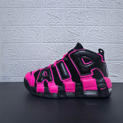 Side profile of a black and pink Nike Air More Uptempo sneaker
