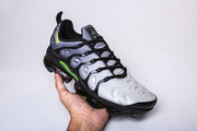 Single silver-gray, black, and green Nike TN-9 sneaker shown at an angle.