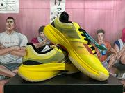 Angled view of yellow and black low-top basketball shoes