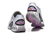 Rear and outsole views of Nike Air Max DN sneakers with gray and purple details.