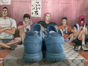Rear view of the blue basketball sneakers showing padded collars, sculpted heels, and outsole details.