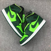 Top-down view of the pair showing fluorescent green laces, toe panels, and dark green overlays.