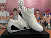 Angled view of two white Nike basketball sneakers showing the Swoosh branding, lace-up construction, textured uppers, and black midsole inserts.
