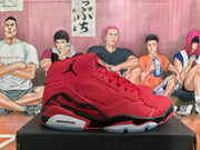 Side profile of a red high-top sneaker with black Jumpman logo and sculpted midsole