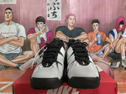 Front view of the black and white Nike sneakers showing perforated toe panels, black laces, and contrasting upper details.
