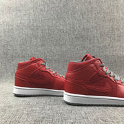 Side profile of the pair showing the high-top shape, side branding, white midsoles, and gray outsoles.