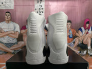 Rear view showing the white heel panels, textured ankle areas, and black sections near the midsoles.